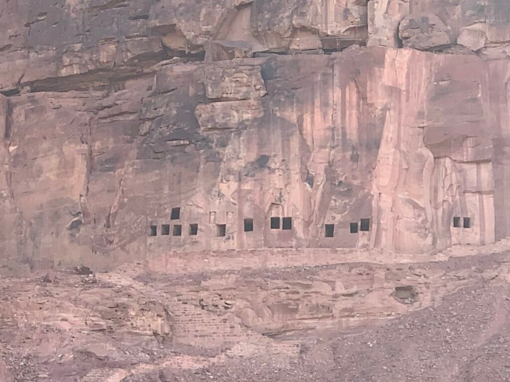 Budget Itinerary for Saudi Arabia.  Dadan tombs, and spot the pair of lions above one of them.