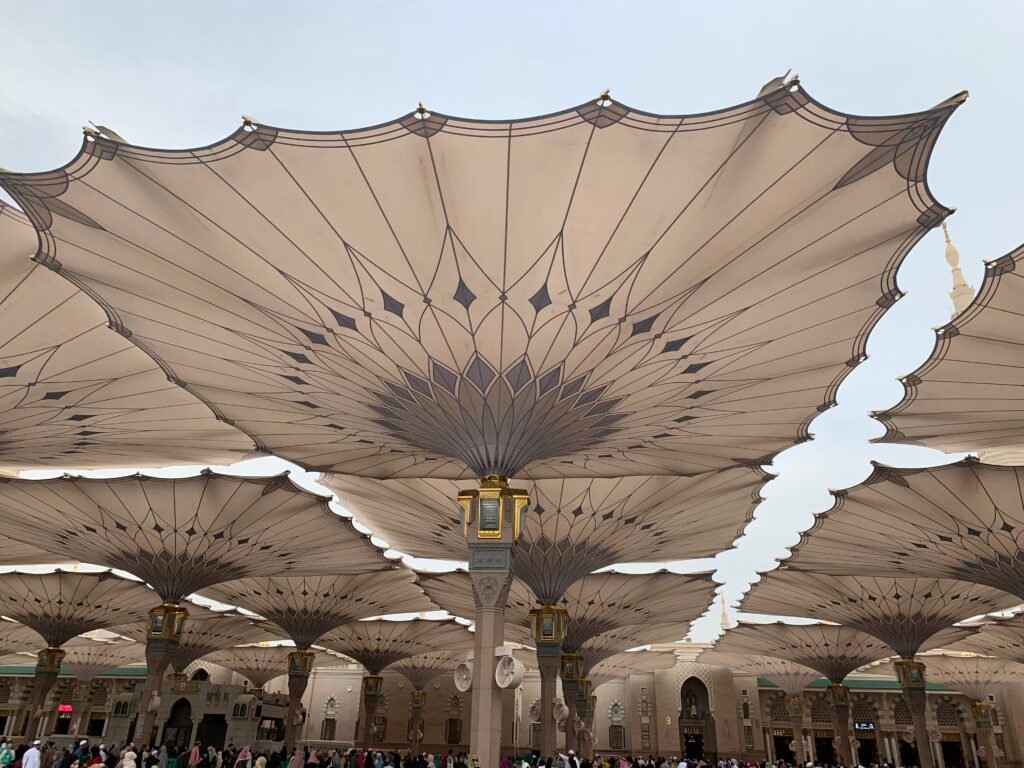 Budget Itinerary for Saudi Arabia.  The mesmerizing retractable umbrellas at Masjid Al Nabawi in Medina projects a sense of calm and serenity