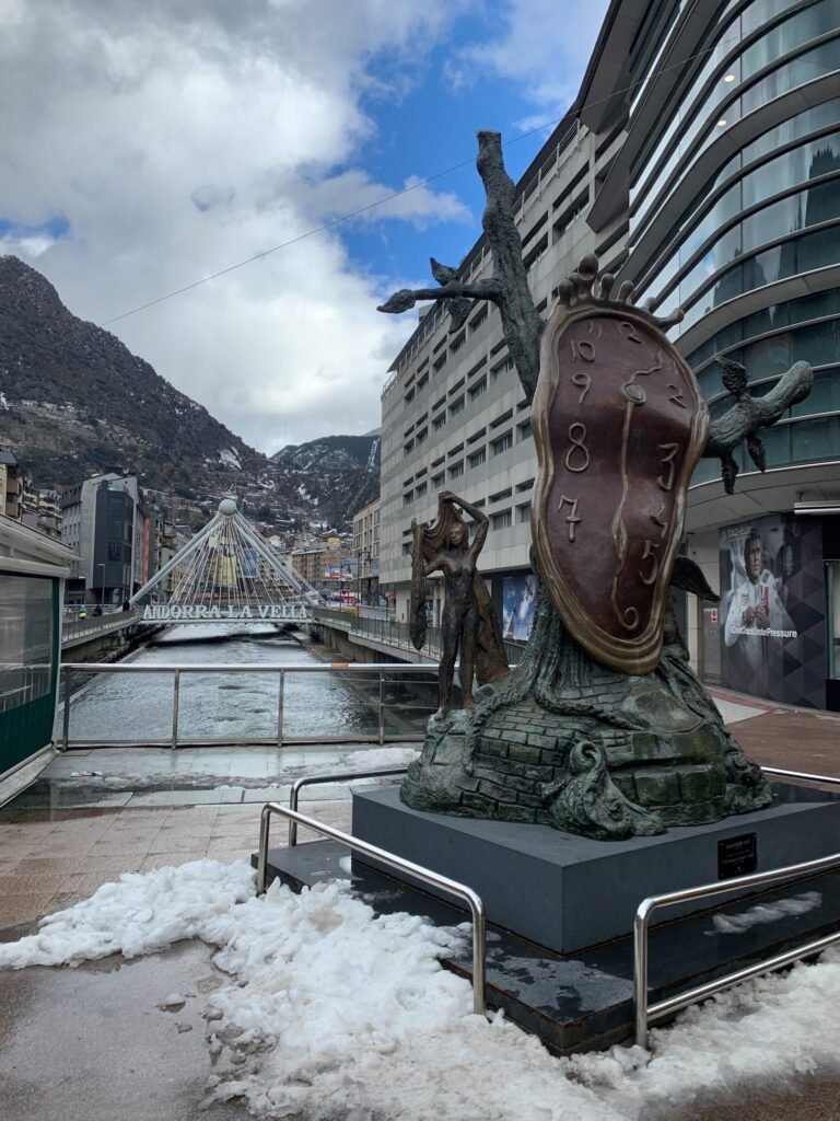 Day trip to Andorra. Salvador Dali's The Nobility of Time. IN the background is the Pont de Paris over the river La Valira.
