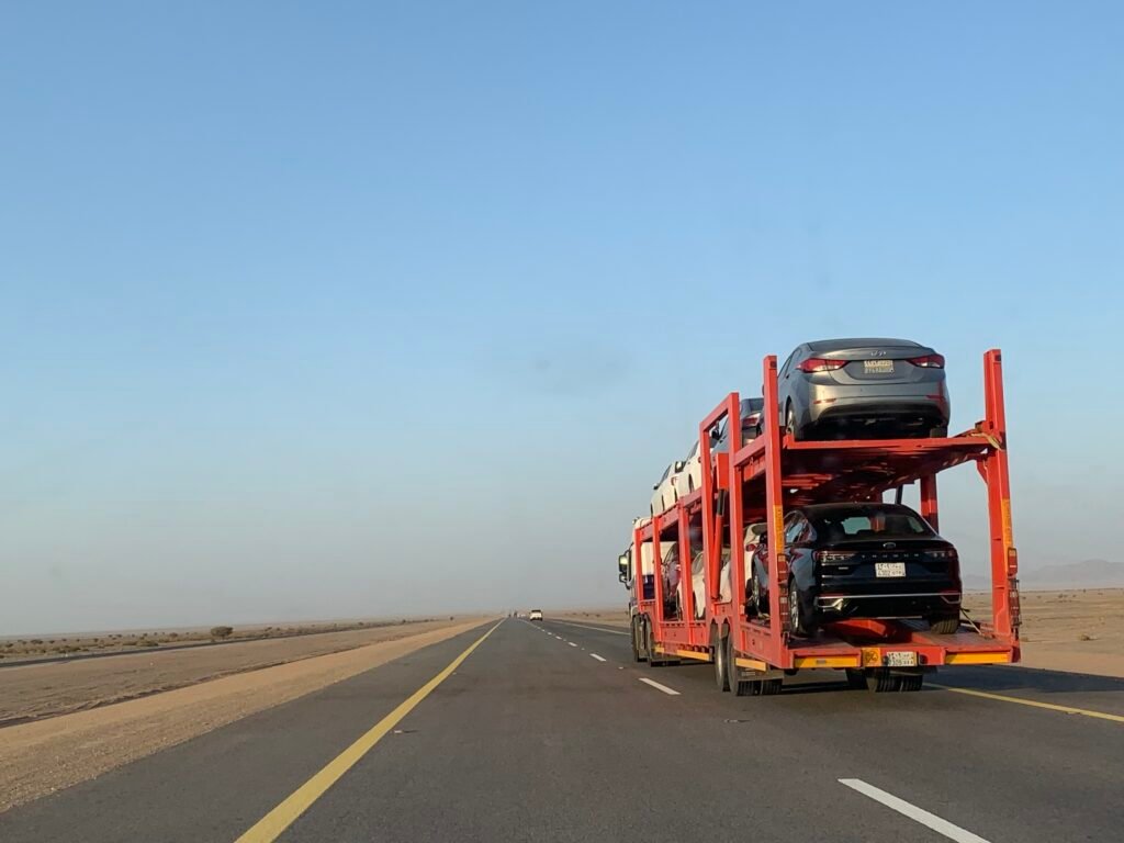 Rental cars on the trailer for their haul back to Riyadh