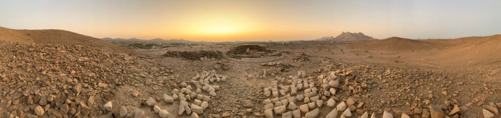 10 best things to do in Oman for Free. at the top of a mount near a tomb at Bat Necropolis