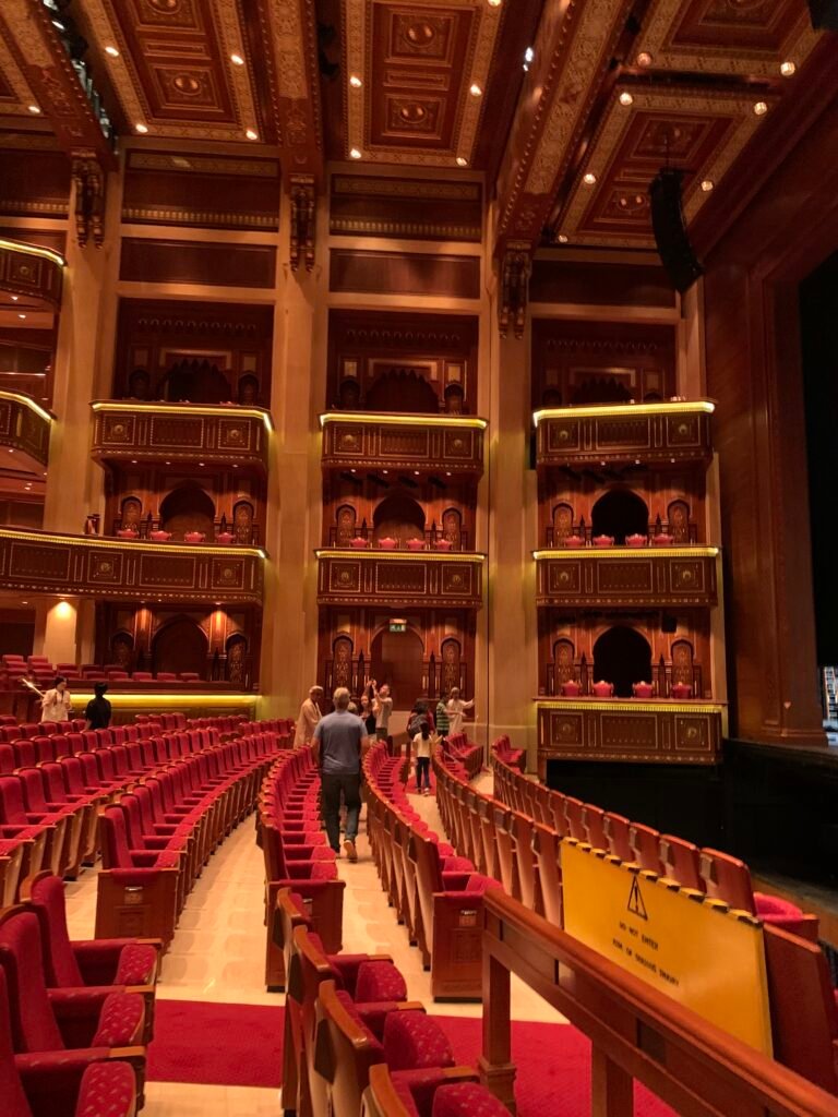 Budget Itinerary Oman. Touring The Royal Opera House of Muscat and its interior which boasts a movable panel balcony seats near to the stage.
