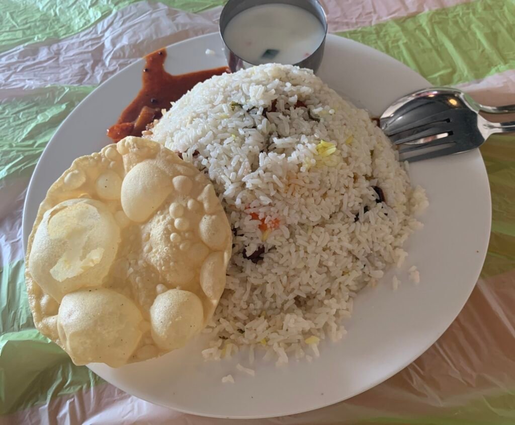 What I ate in Oman. OMR 1 with this plate of rice and the Papadam was the hero.