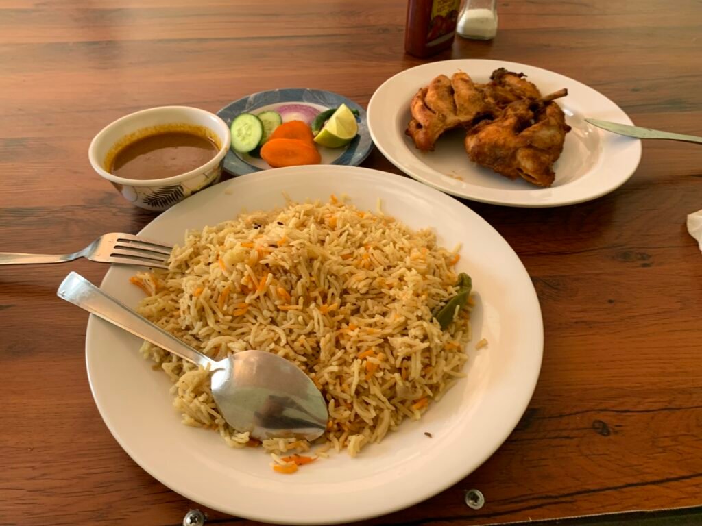 What I ate in Oman. OMR1.7 for half a spring chicken that came with the biryani.