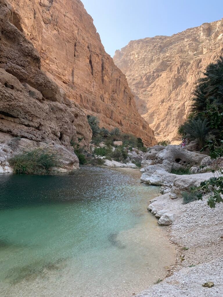 The second pool at Wadi Shab amongst steep mountain edges.