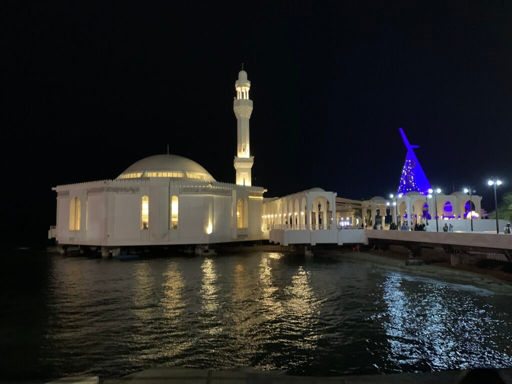 The Al Rahmah mosque in the evening when it is cooler at the Jeddah Corniche.