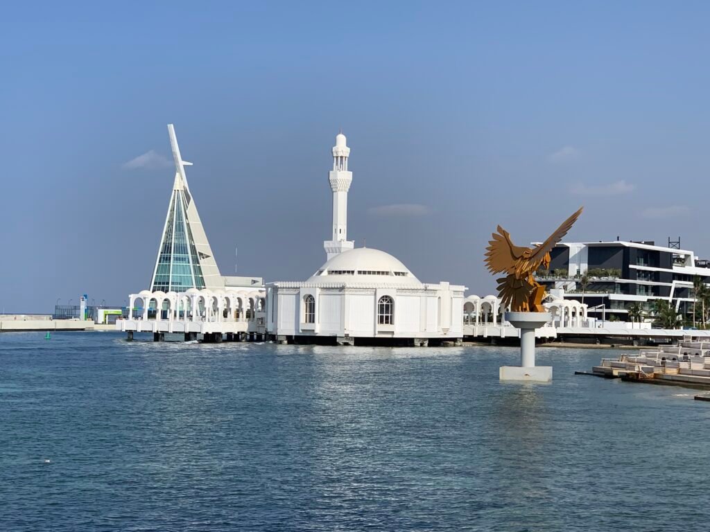 Al Rahmah Mosque by day with the Eagle at Jeddah Corniche.