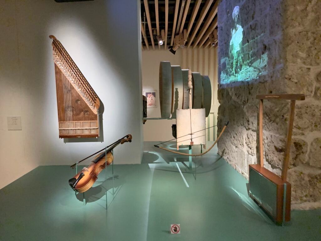 Inside the Tariq Abdulhakim Center showcasing musical instruments and exhibits related to music compositions.