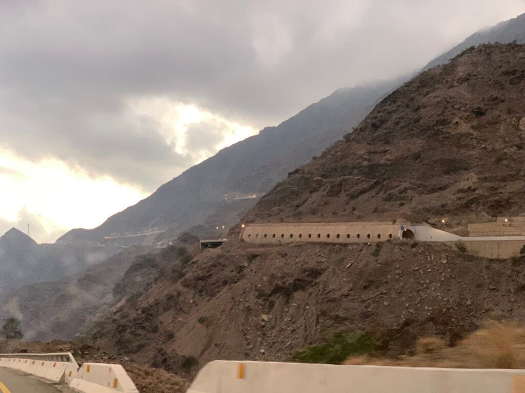 Driving by the Edge and through tunnels down to Thee Ain Heritage Village from Al Bahah.