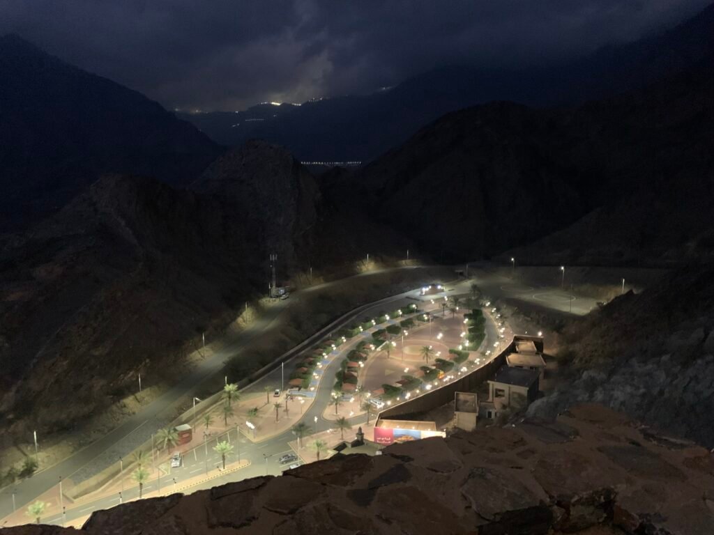 Budget Itinerary for Saudi Arabia. Parking lot at Thee Ain showing the Kia Pegas rental car