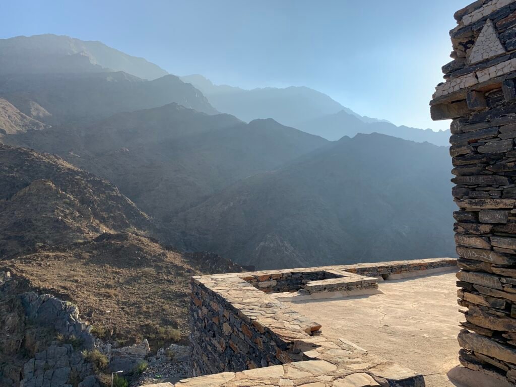 Misty mountains against rays of morning light at Thee Ain Heritage Village