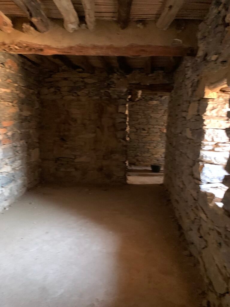 Walking through one of the dwelling units at Thee Ain Heritage Village