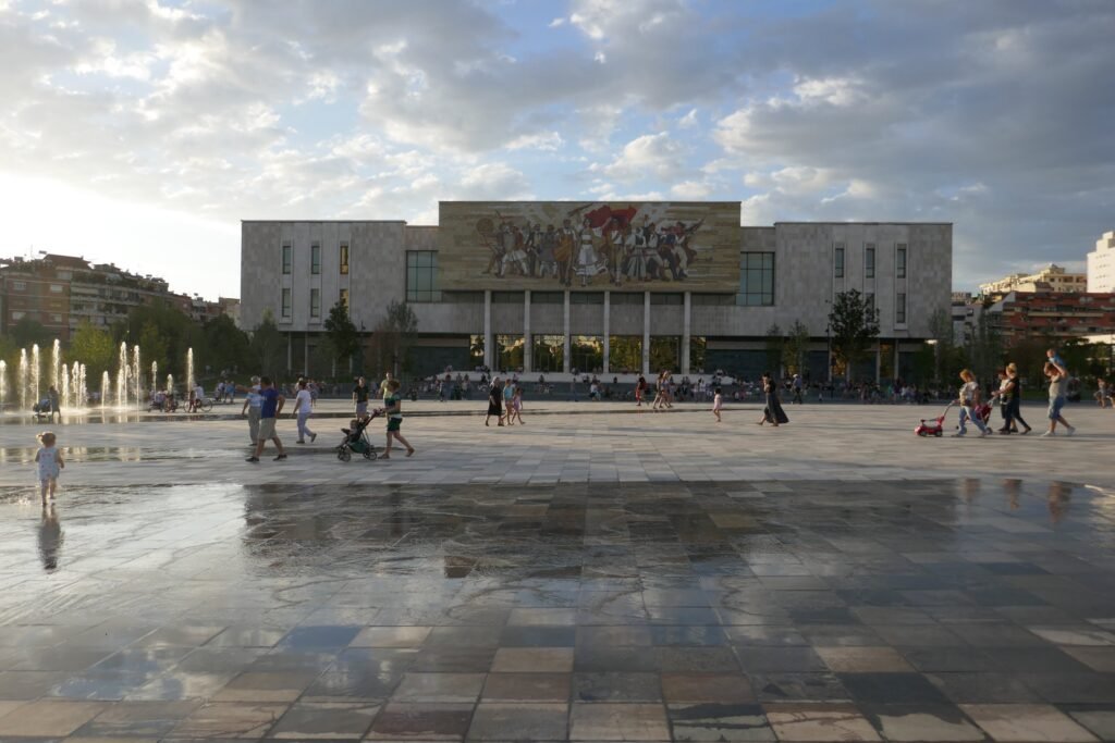 Budget Itinerary Albania. Skanderbeg Square with purposeful puddles of water that are pretty slippery!
